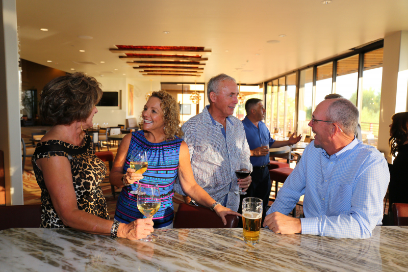 Members celebrating at the bar